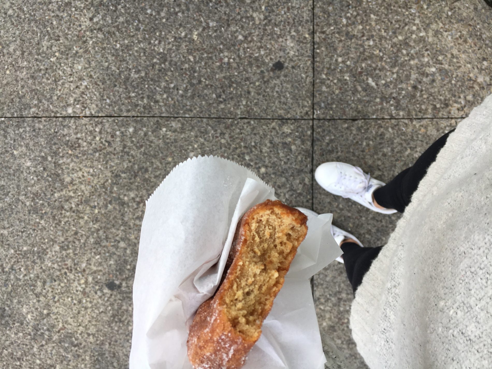 women holding a donut